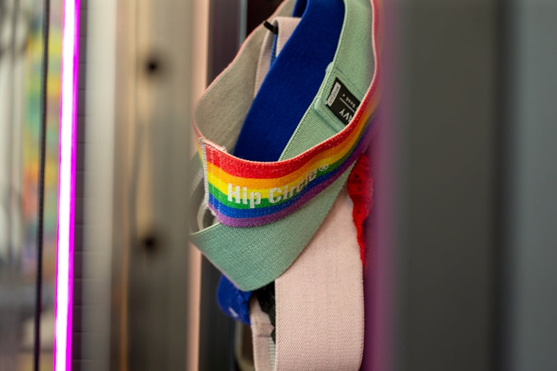 Resistance bands with rainbow stripes hang